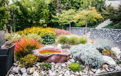 A beautifully landscaped garden with a water feature